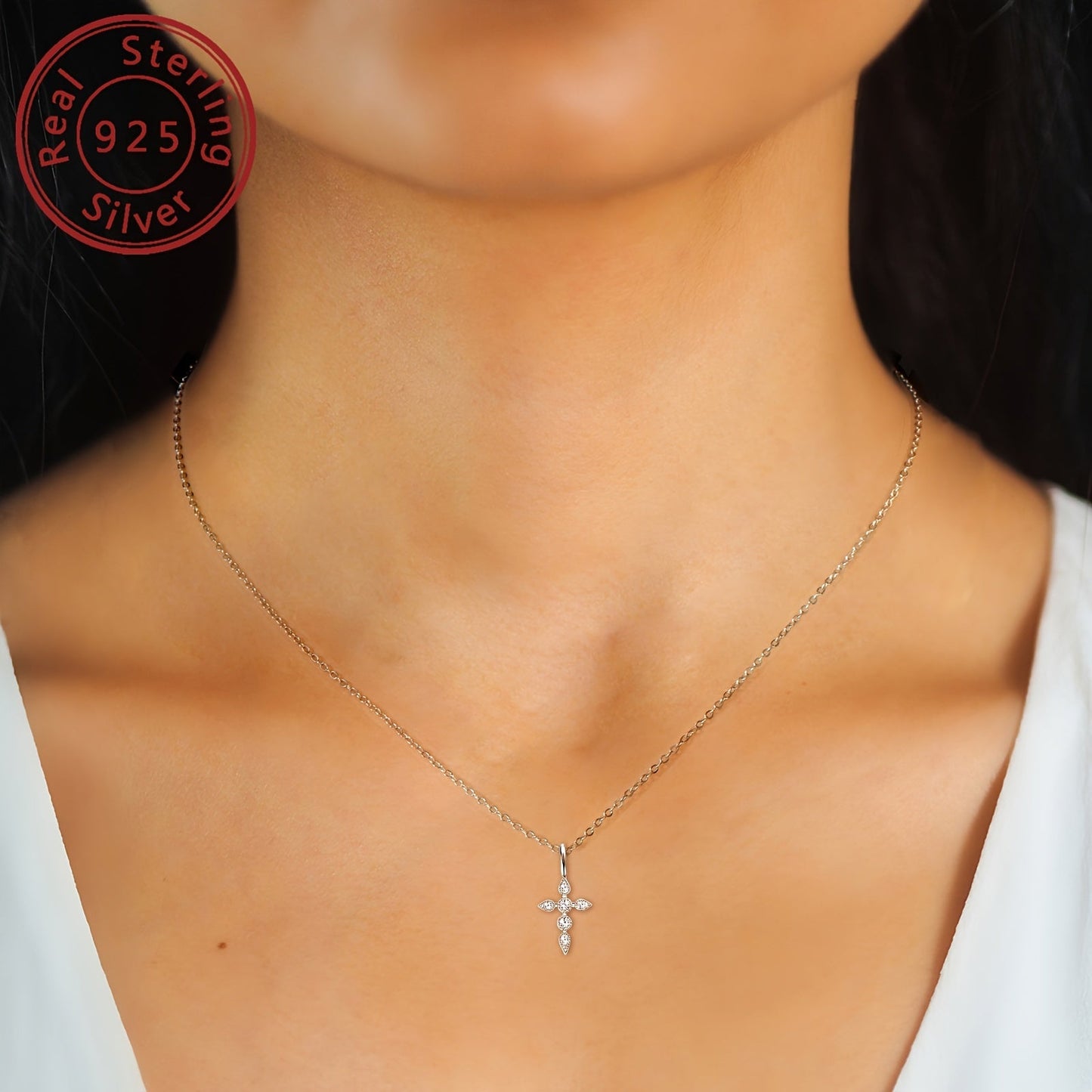 A stunning Mozambique stone cross necklace featuring a 925 sterling silver cross pendant. The necklace is decorated with a round Mozambique stone, measuring 40+5cm/16+2 inches in length. The silvery weight of the necklace is 2.29g, with the Mozambique