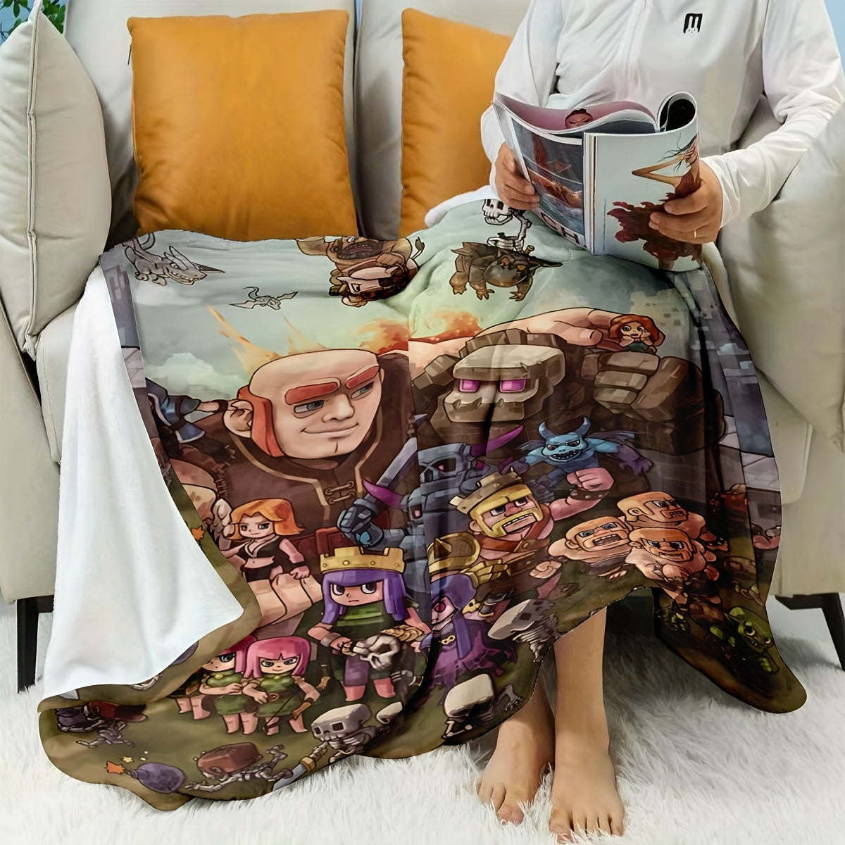 Flannel fleece blanket featuring Clash of Clans characters design, perfect for all seasons. This blanket is contemporary in style, machine washable, and made of polyester with anti-soil properties. The digital print design makes it suitable for gaming