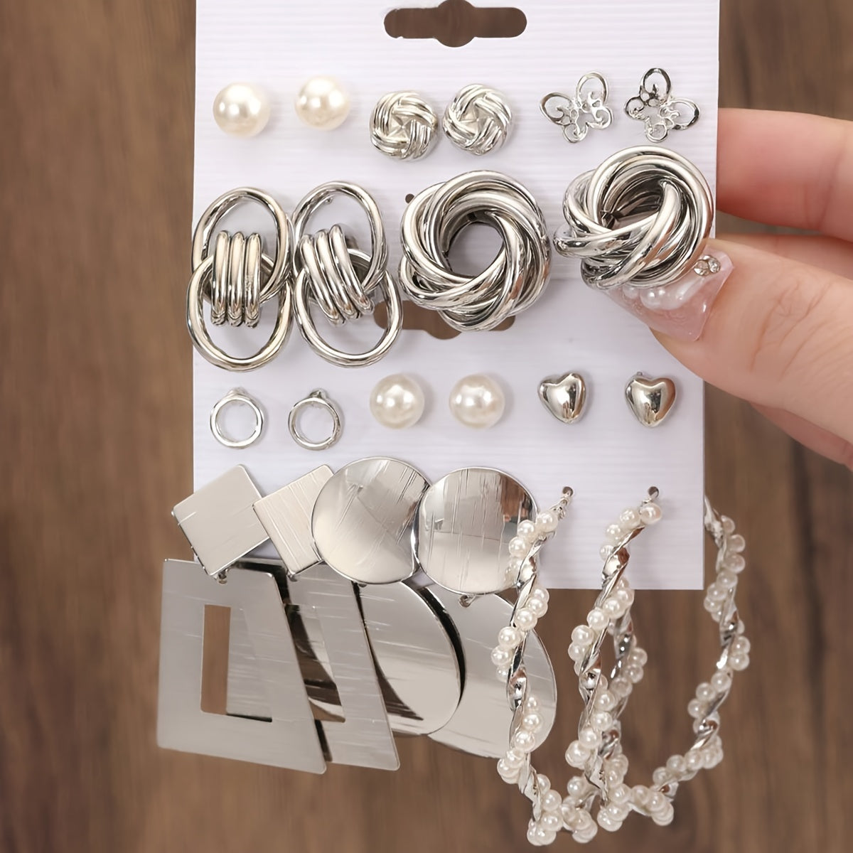 A stunning 10-piece vacation set featuring simple yet exaggerated European and American metal style. These Butterfly Twist Polygon Imitation Pearl Earrings are perfect for women who want to stand out at any party, travel adventure, or holiday getaway.