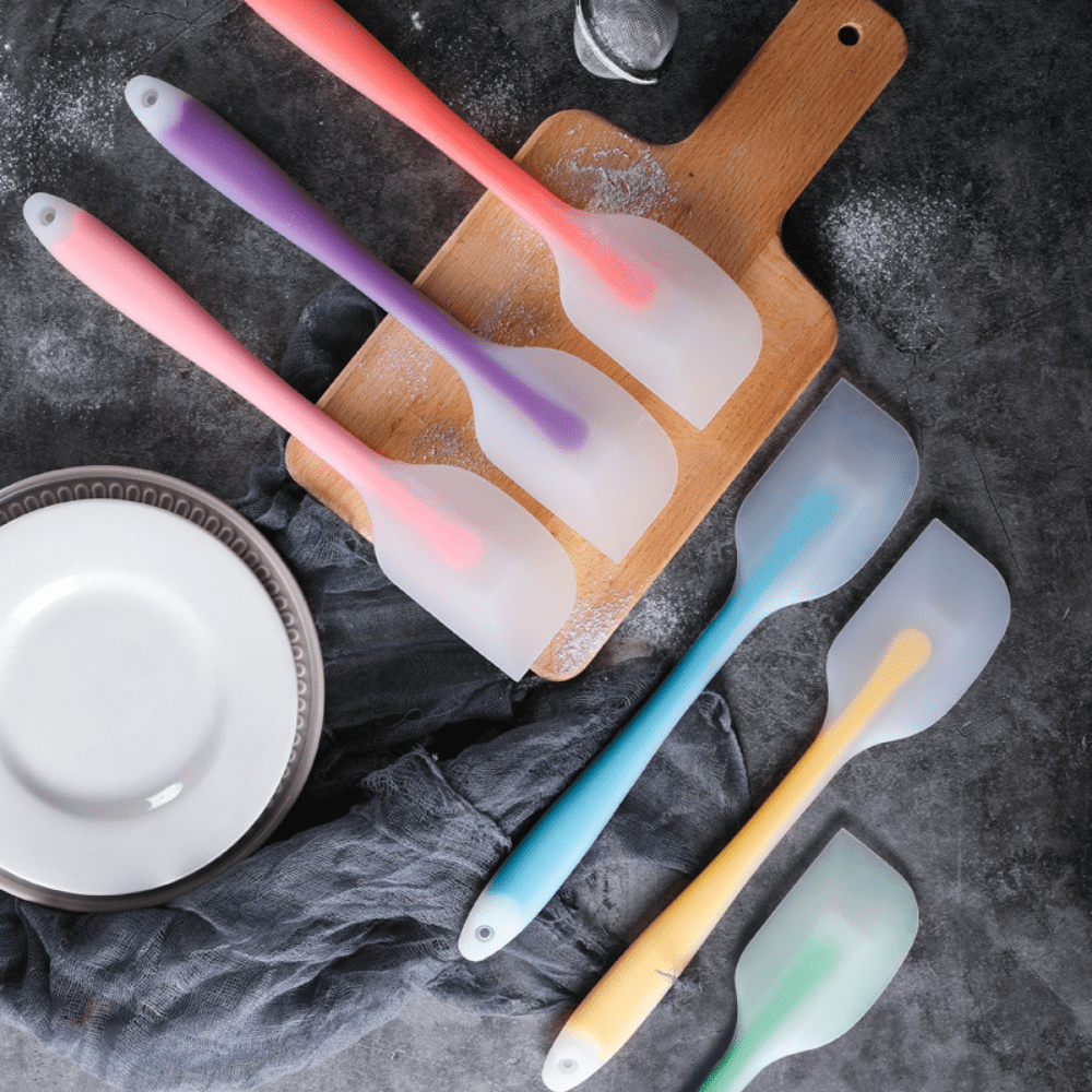 Versatile silicone scraper set includes two sizes for baking, made of durable and heat-resistant material, available in a variety of colors.