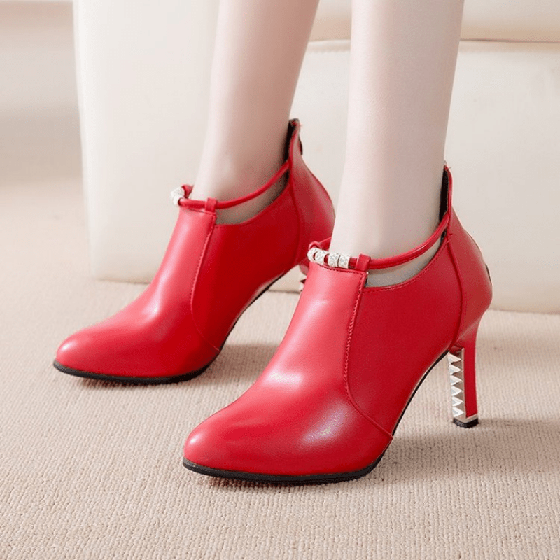 Stylish pointed toe stiletto boots with heel zipper for women.