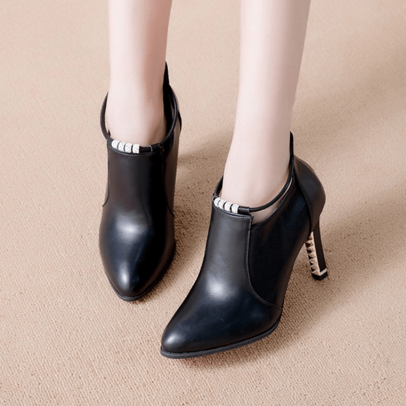 Stylish pointed toe stiletto boots with heel zipper for women.