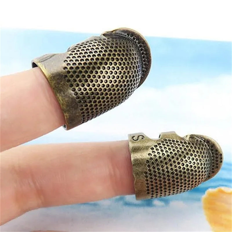 Vintage metal thimble for needlework and crafting.