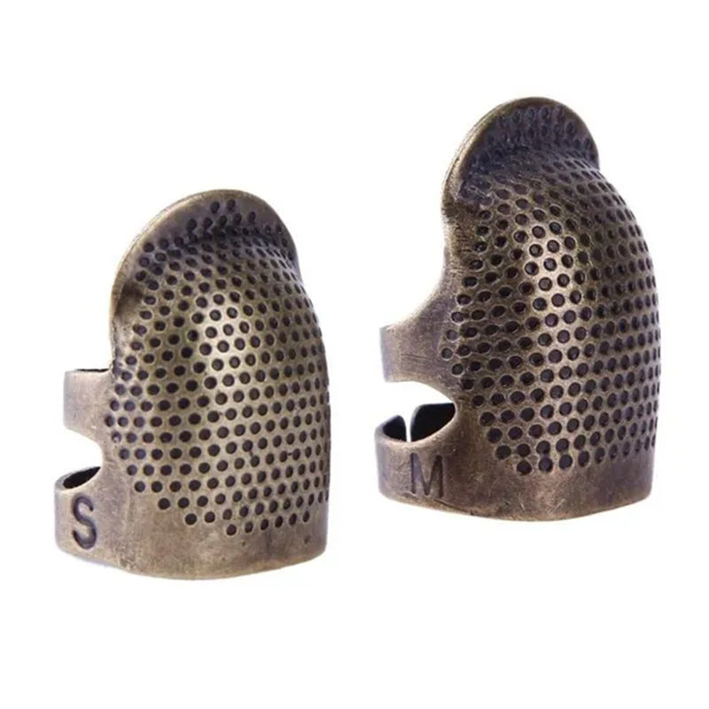 Vintage metal thimble for needlework and crafting.