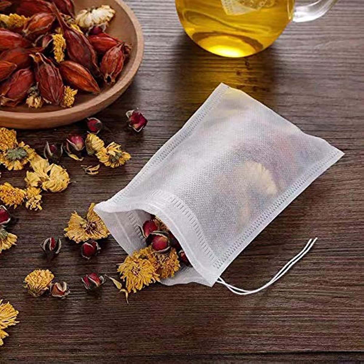 400 pieces of Tea Filter Bags, Disposable Empty Drawstring Seal Filter Loose Leaf Tea Bags measuring 8.99 X 6.99 cm.