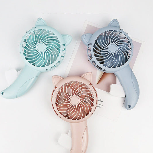 The WhimsyCat Manual Handheld Fan is a compact and portable personal cooling solution. Made of durable plastic, this cute cartoon-designed fan is perfect for use around the house. With no batteries required, you can enjoy a refreshing breeze wherever you