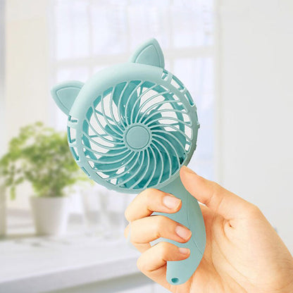 The WhimsyCat Manual Handheld Fan is a compact and portable personal cooling solution. Made of durable plastic, this cute cartoon-designed fan is perfect for use around the house. With no batteries required, you can enjoy a refreshing breeze wherever you