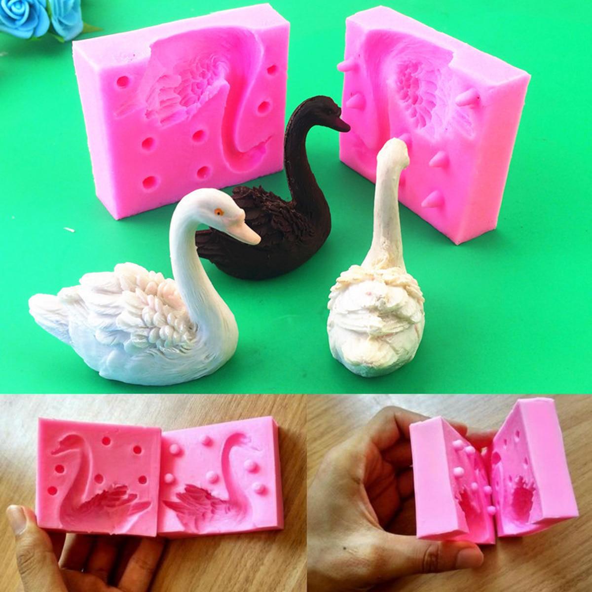 Silicone mold for creating a beautiful 3D swan design, perfect for making fondant candles, chocolate cakes, and decorating baked goods. This baking tool is both practical and aesthetically pleasing.