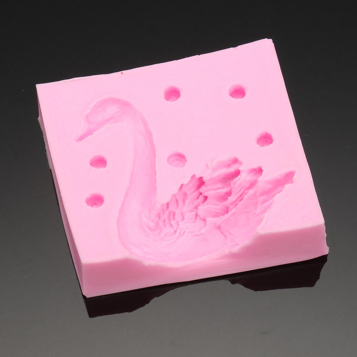 Silicone mold for creating a beautiful 3D swan design, perfect for making fondant candles, chocolate cakes, and decorating baked goods. This baking tool is both practical and aesthetically pleasing.