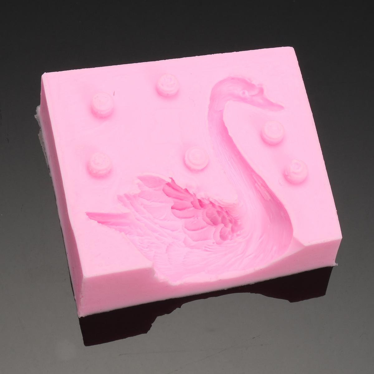 Silicone mold for creating a beautiful 3D swan design, perfect for making fondant candles, chocolate cakes, and decorating baked goods. This baking tool is both practical and aesthetically pleasing.