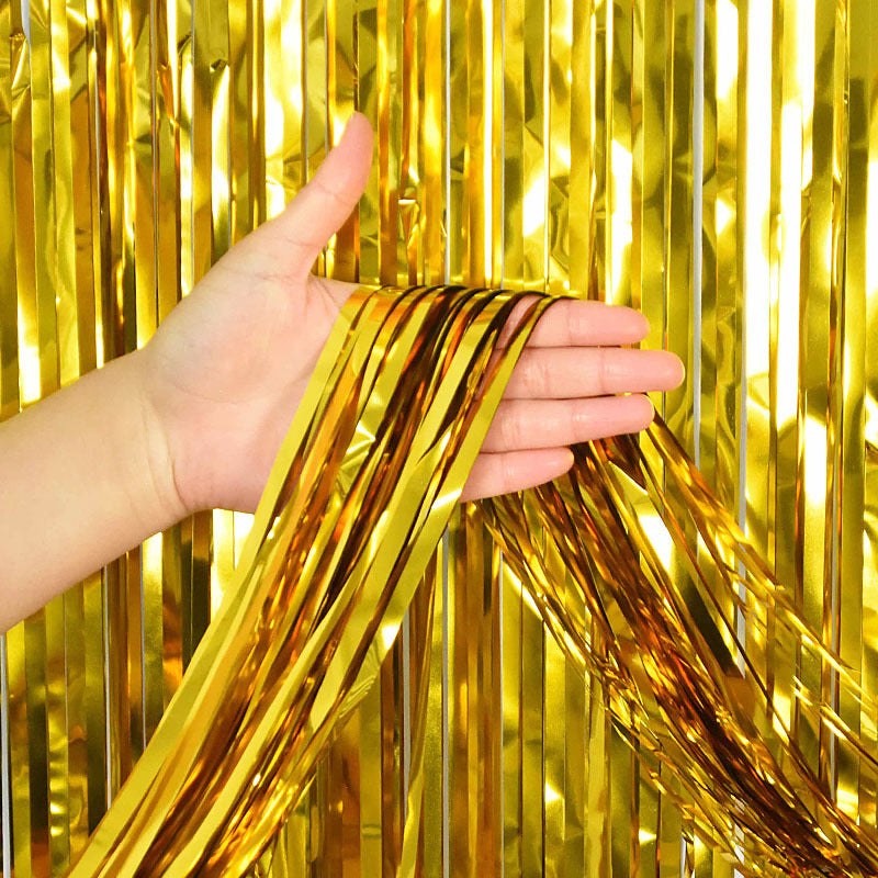 Metallic foil fringe tinsel streamer for party decoration, suitable for birthdays, weddings, showers, and more.