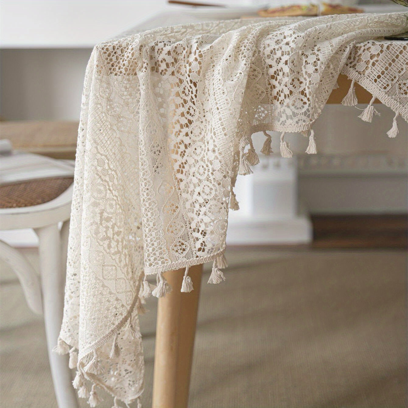 Bohemian chic crochet lace tablecloth, ideal for dining and parties. Rectangular polyester design with a farmhouse style, perfect for boho home decor. Great for buffet tables, banquets, and serving western food.