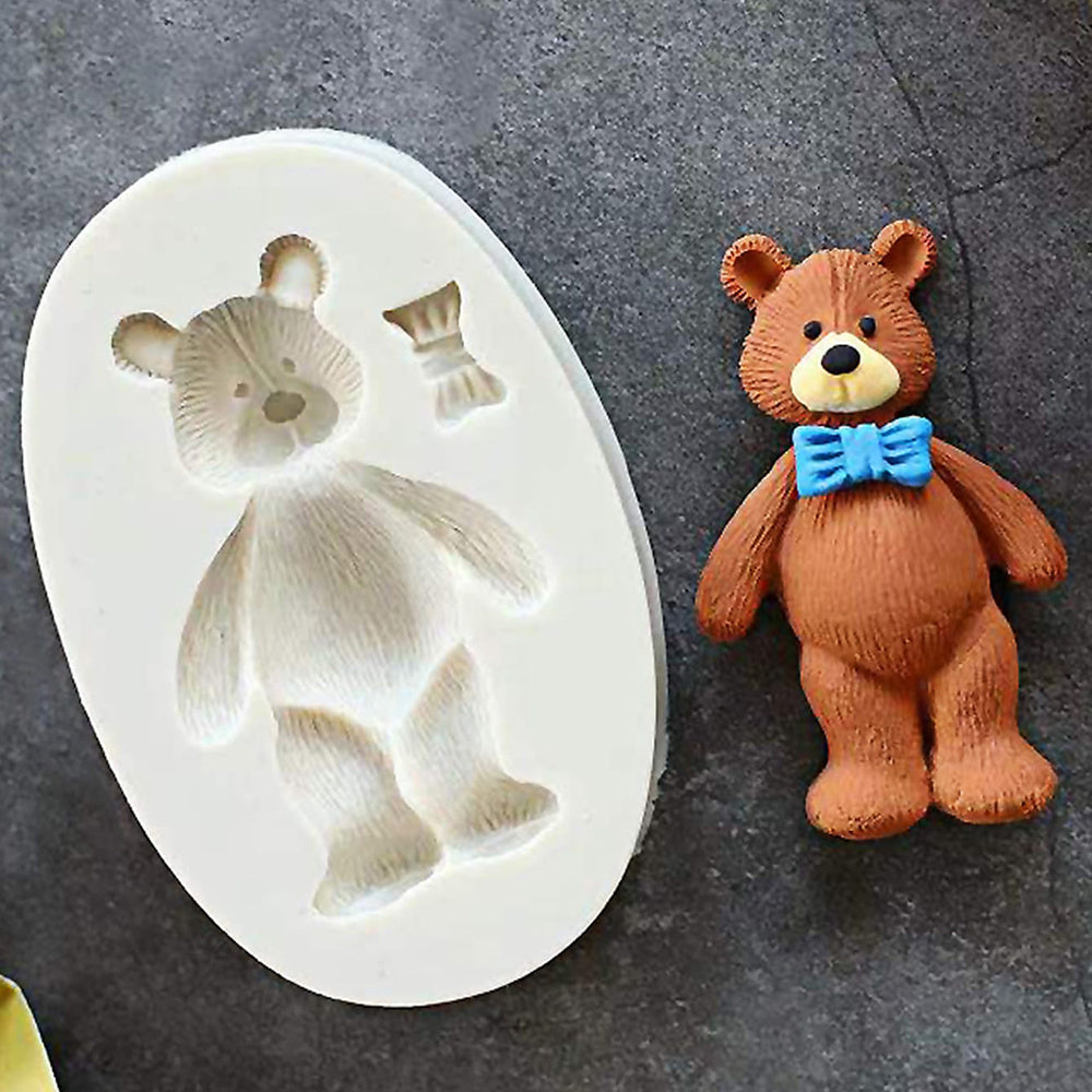 One-piece Cute Bear Chocolate Mold - This 3D Silicone Cartoon Candy Mold is perfect for DIY Cake Decorating and Baking. Featuring a Kawaii design with a Bowtie, this Fondant Mold is a must-have Kitchen Gadget and Home Kitchen Item.