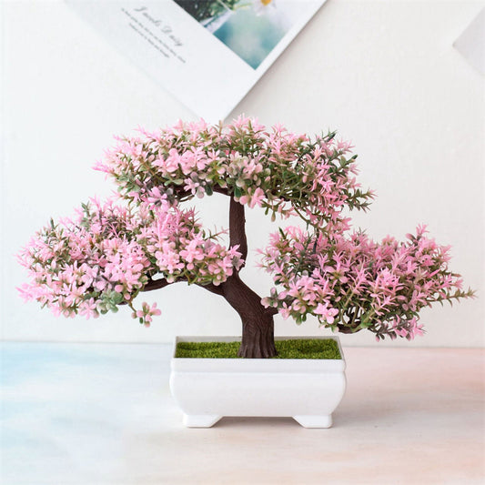 Realistic artificial bonsai tree in small pot for home or garden decoration.