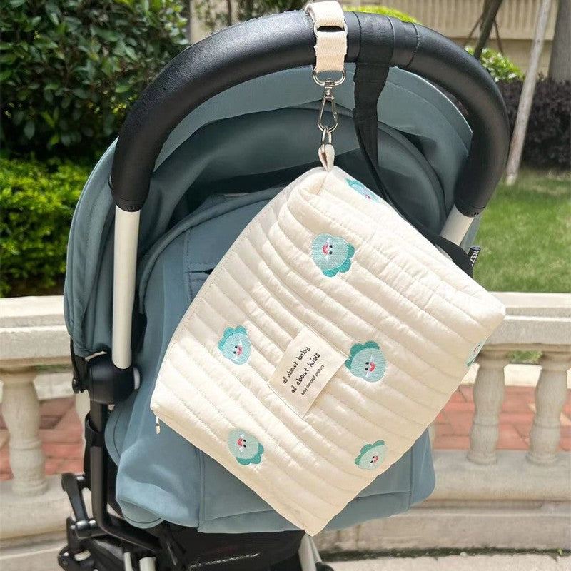 Embroidered Cotton Mommy Bag with Zipper Closure for Stroller Hanging, suitable for Diaper Bag use.