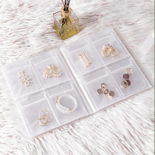 Travel jewelry organizer with 84/160 grids, large capacity earring and ring storage, clear display case for rings, and antioxidant bags for necklaces.