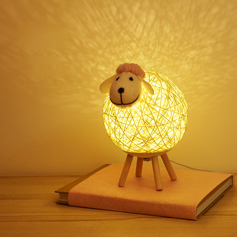 Handwoven LED sheep night light with remote control for bedroom decor and sleeping.