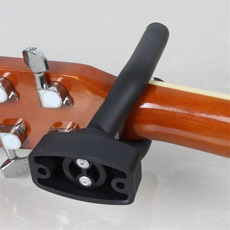 Display your guitar stylishly and securely with this wall mount, includes hooks and picks.