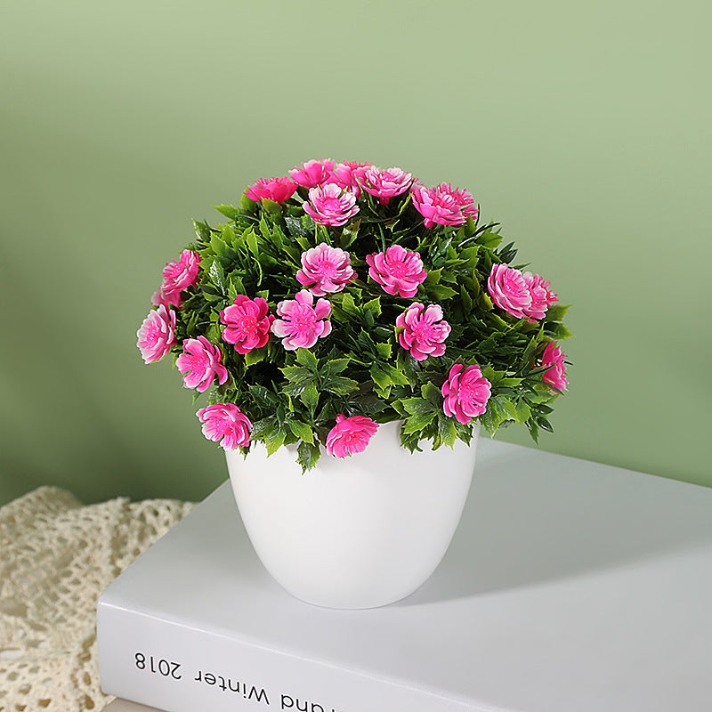 Artificial plant in small daisy pot, ideal for wedding, home, or bedroom decoration. Can be used for simulation or room decor.