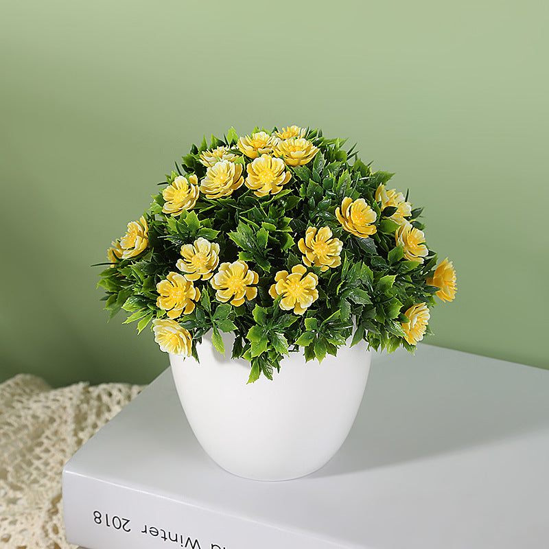 Artificial plant in small daisy pot, ideal for wedding, home, or bedroom decoration. Can be used for simulation or room decor.