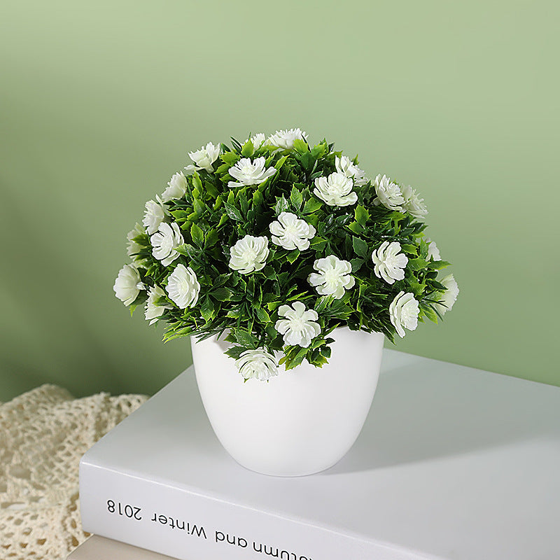 Artificial plant in small daisy pot, ideal for wedding, home, or bedroom decoration. Can be used for simulation or room decor.