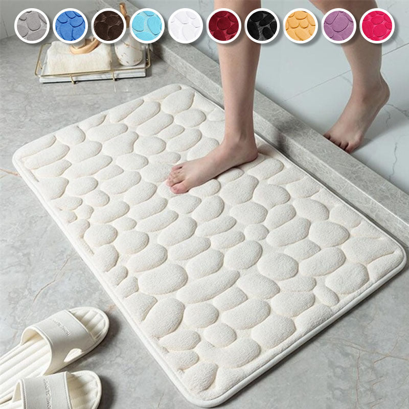 Soft, non-slip cobblestone bath rug absorbs water quickly for various indoor uses.