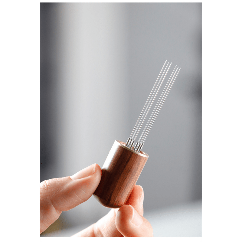 The Laoyeboubi Espresso Distribution Tool (WDT) is a stainless steel coffee stirrer needle distributor designed to create even grounds for optimal espresso extraction. This barista accessory allows for improved espresso extraction without the need for