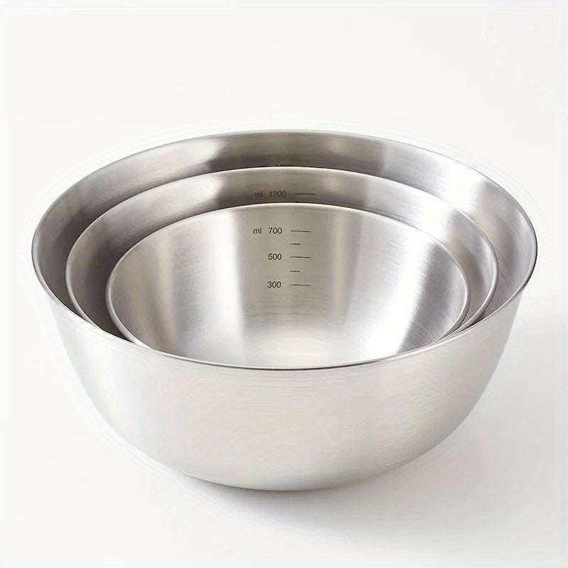 Set of 3 durable stainless steel mixing bowls for easy kitchen prep and storage.