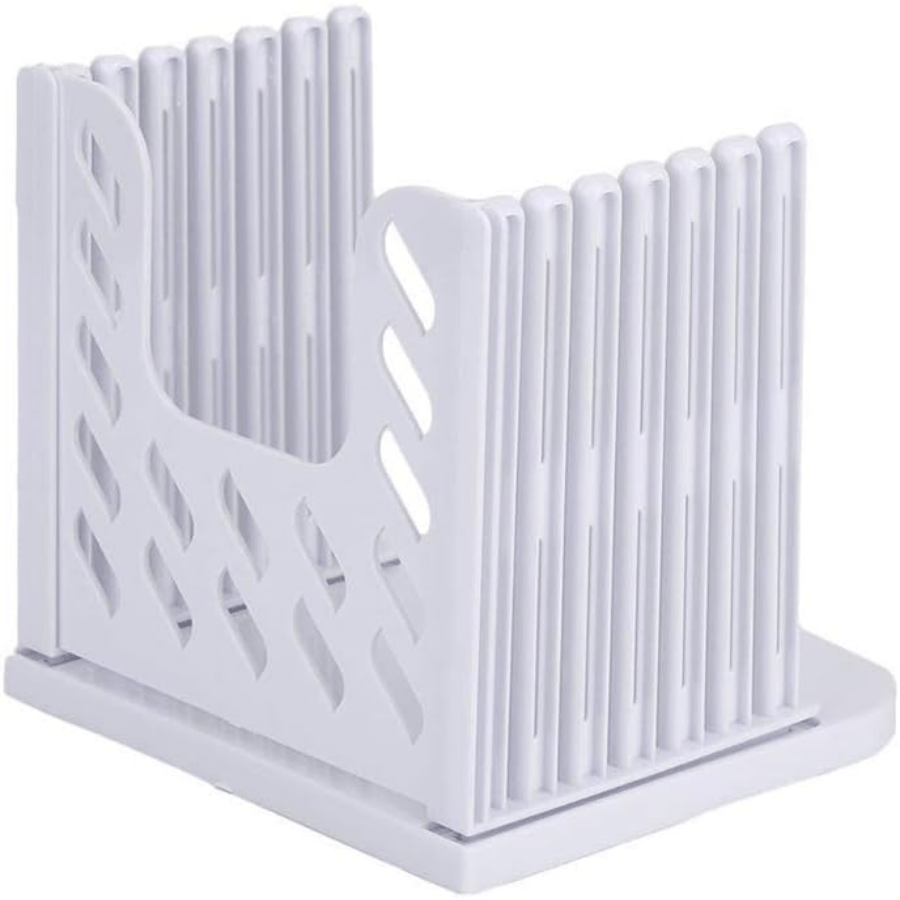 Adjustable Toast Slicer Cutting Guide - Perfect for Homemade Bread! 
This plastic bread slicer is ideal for slicing bread loaves. It is foldable and convenient for kitchen baking. Get yours in white now at a clearance price!