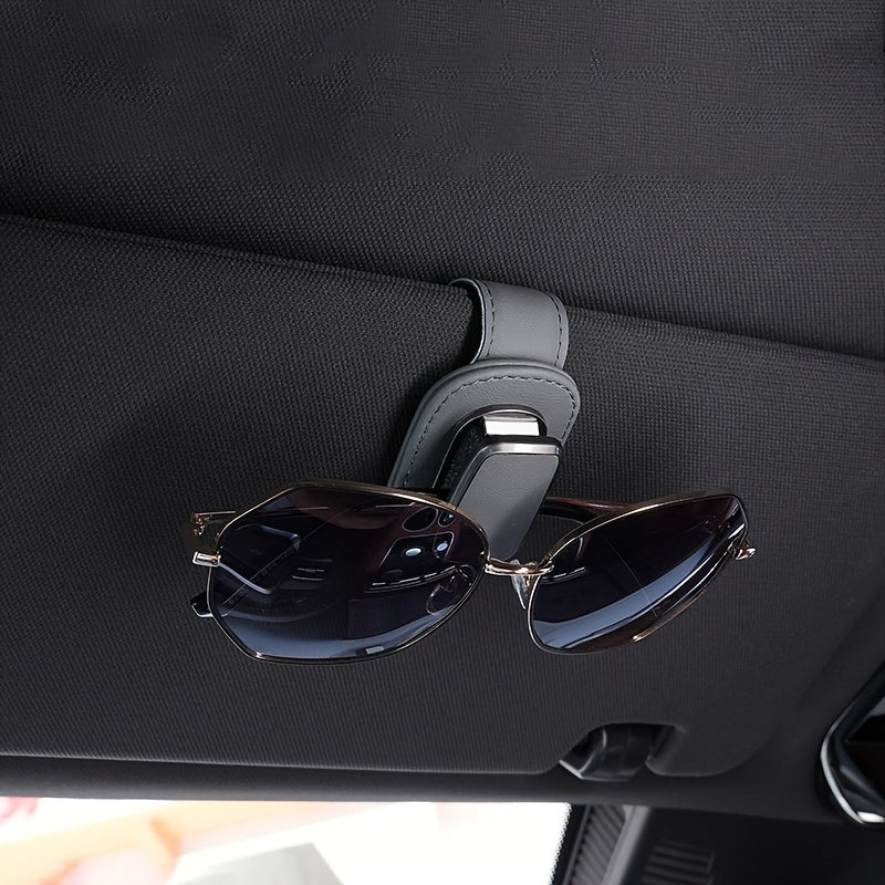 High-quality faux leather car sun visor clip with sturdy glasses holder, universal fit for dashboard and console storage.