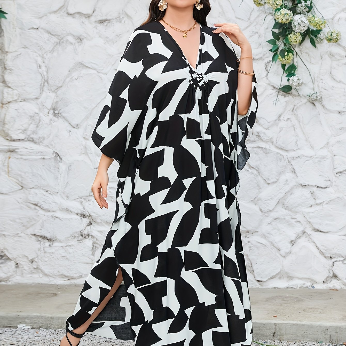 Boho-chic handwoven viscose beach kaftan dress in plus size, featuring a v-neck, 3/4 sleeves, a geometric black & white pattern, and machine washable. Great for vacation.