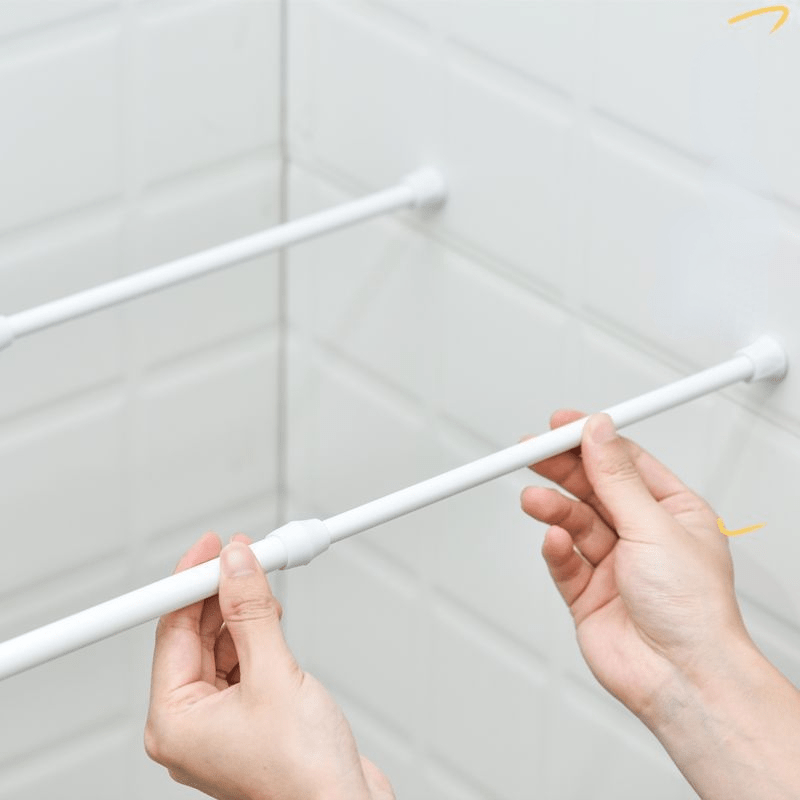 Versatile no-drill curtain rod in white plastic. Ideal for shower and window dressing. Minimalist and durable tension rod.