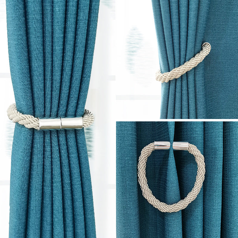 Simple and modern magnetic curtain tieback made of thick rope, perfect for holding back curtains in bedroom or living room decor.