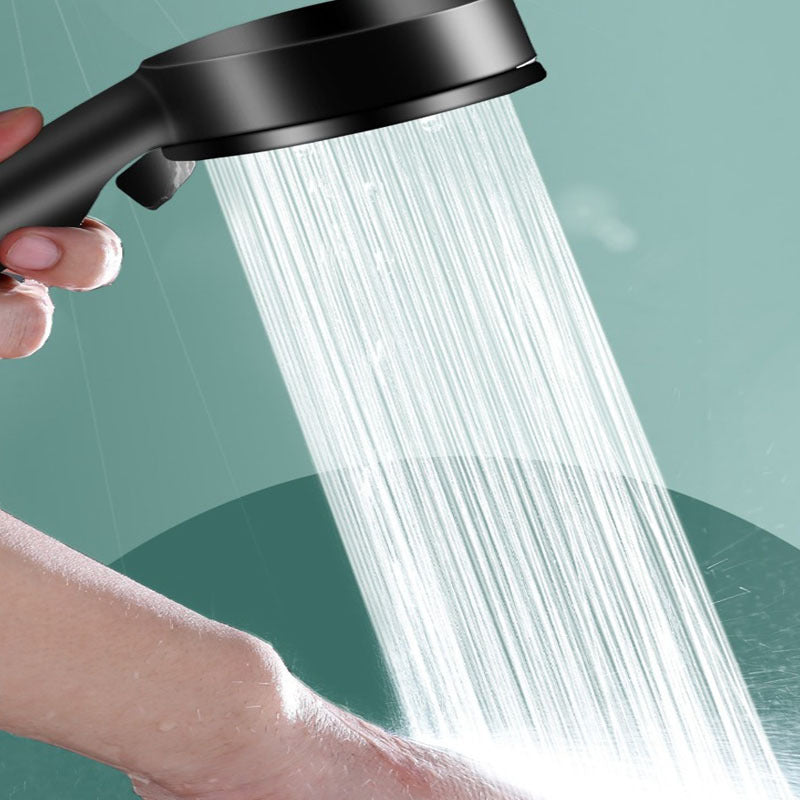 Handheld shower head with 5 spray modes in energy-saving ABS material, wall-mounted and enhances shower experience with various settings.