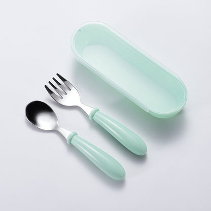 Set of 3 stainless steel youngsters' utensils with colorful handles, dishwasher safe. Includes fork and spoon in blue geometric pattern in pink and green cases.