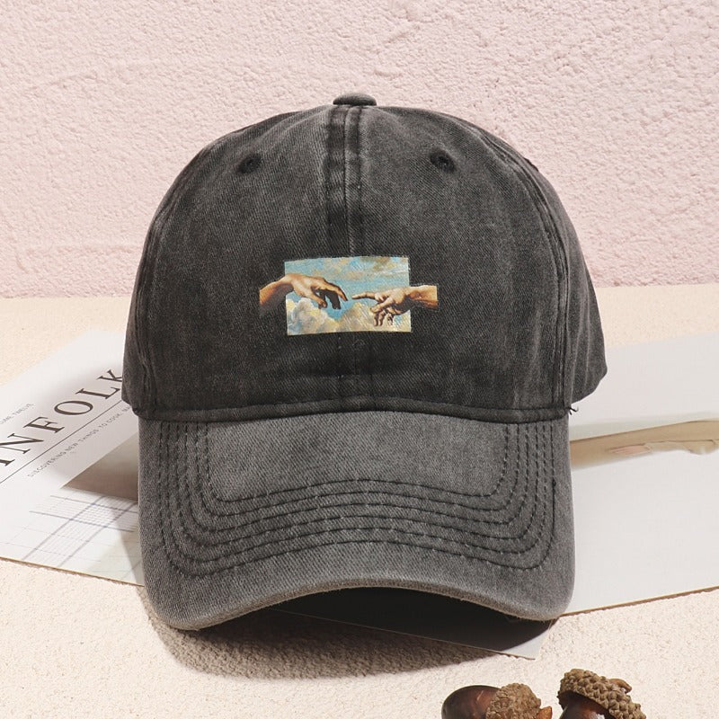 Vintage oil painting print baseball cap made of breathable polyester with casual embroidery. Features a flag theme, adjustable fit, and is hand washable.