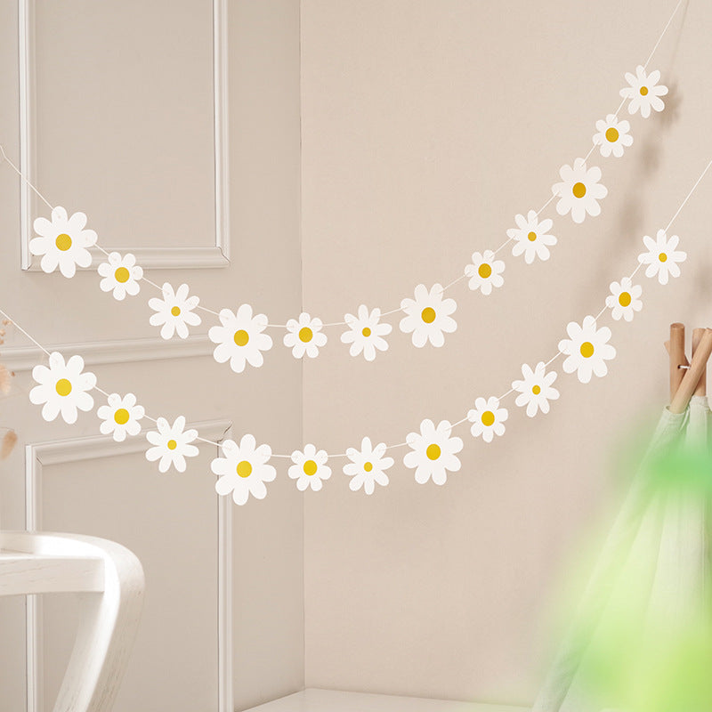 Daisy Boho Banner Party Decorations with White Flower Garland - perfect for indoor or outdoor events like girls' showers or birthdays. Includes groovy party favors.