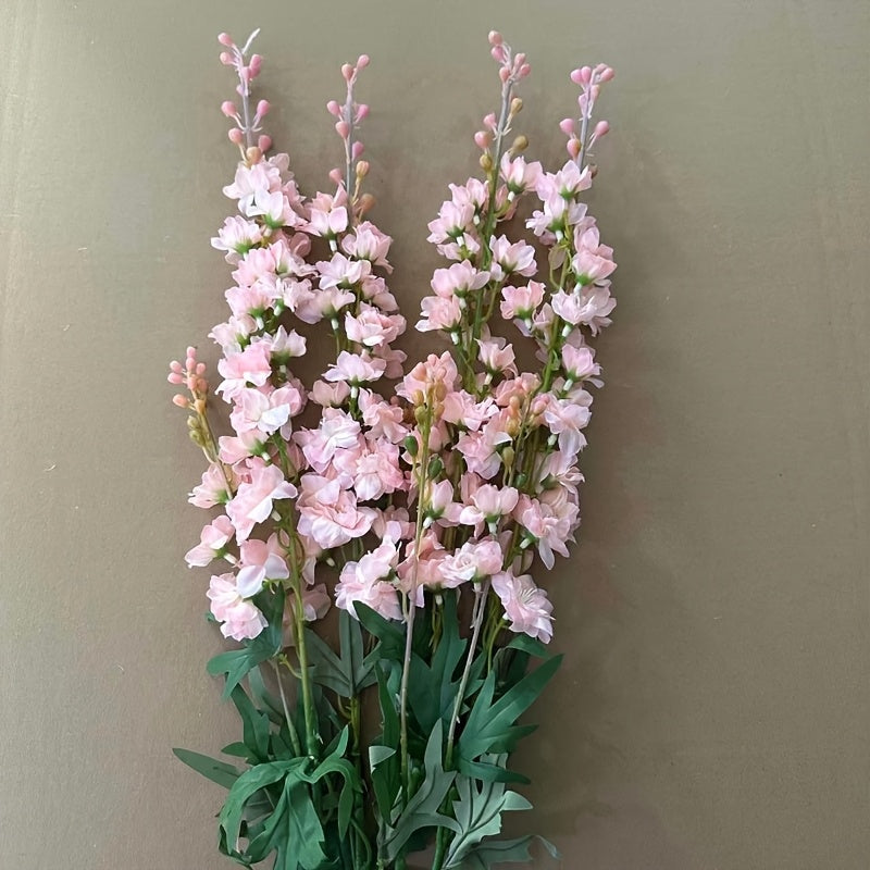 4 pink artificial Delphinium flowers for decoration with a lifelike, realistic touch. Ideal for tall vases in home, wedding or office.