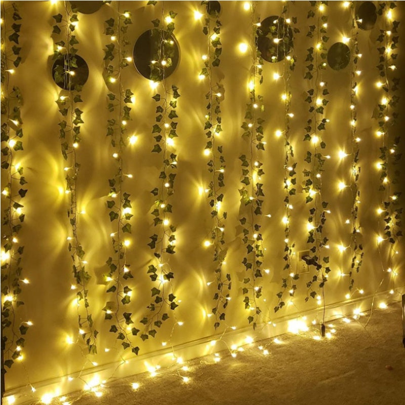 2m artificial ivy vine with 20 LED lights, perfect for home decor during Christmas and Halloween. Battery powered, no plug needed.