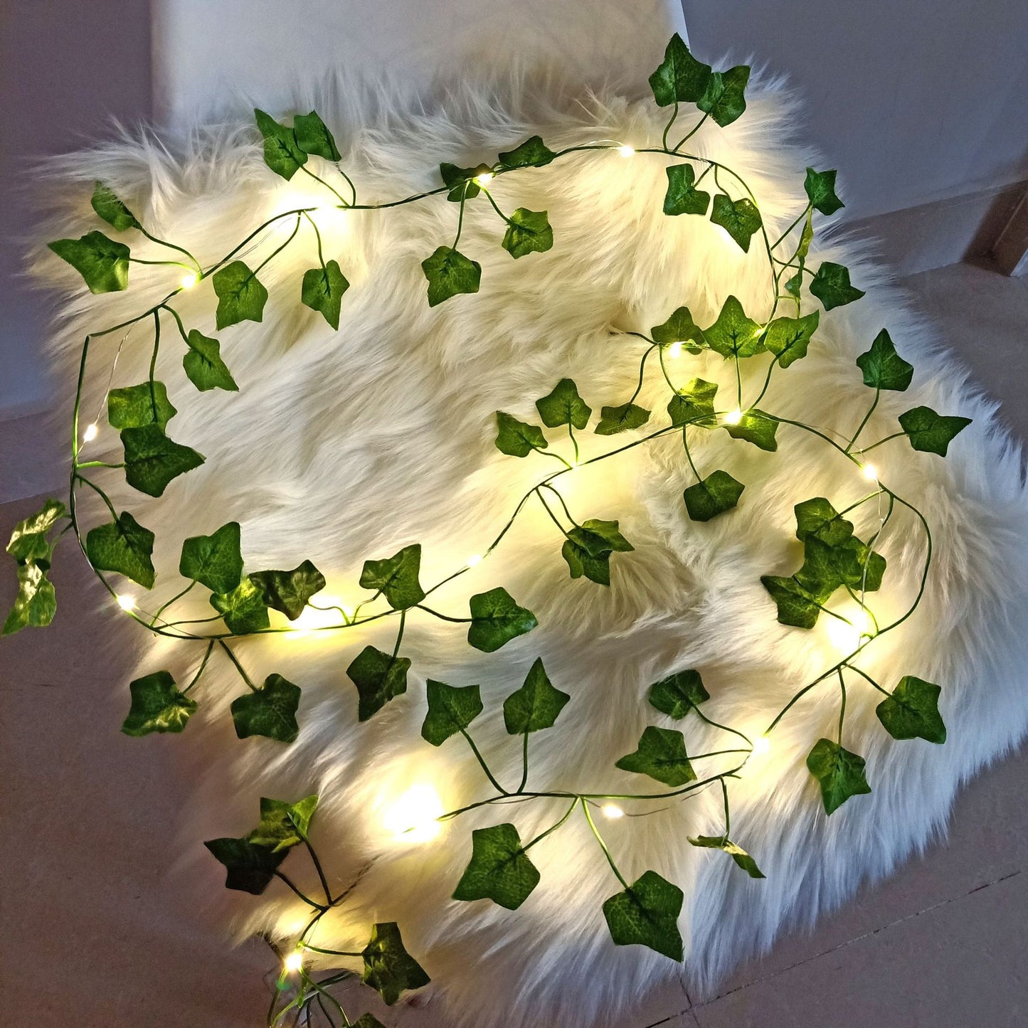 2m artificial ivy vine with 20 LED lights, perfect for home decor during Christmas and Halloween. Battery powered, no plug needed.