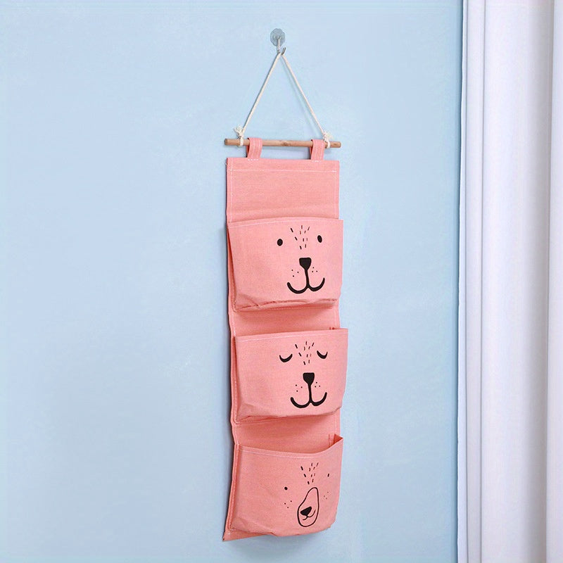 Get organized with this adorable Hanging Storage Bag featuring a Cartoon Pattern design! Perfect for keeping small items tidy in your bedroom, this versatile wall-mounted bag is 60cm in length and makes a great gift for Easter, Halloween, or Christmas.