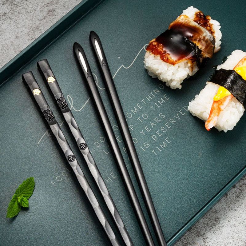 Elegant black and golden chopsticks set for sushi and Asian cuisine, perfect for Christmas and New Year gifts. Made from PET plastic and fiberglass with a textured grip. Great for men and women.