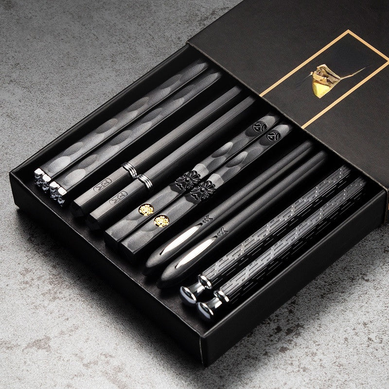 Elegant black and golden chopsticks set for sushi and Asian cuisine, perfect for Christmas and New Year gifts. Made from PET plastic and fiberglass with a textured grip. Great for men and women.