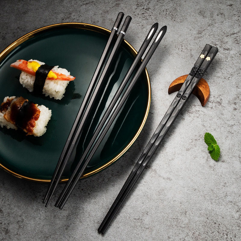 Elegant black and golden chopsticks set for sushi and Asian cuisine, perfect for Christmas and New Year gifts. Made from PET plastic and fiberglass with a textured grip. Great for men and women.