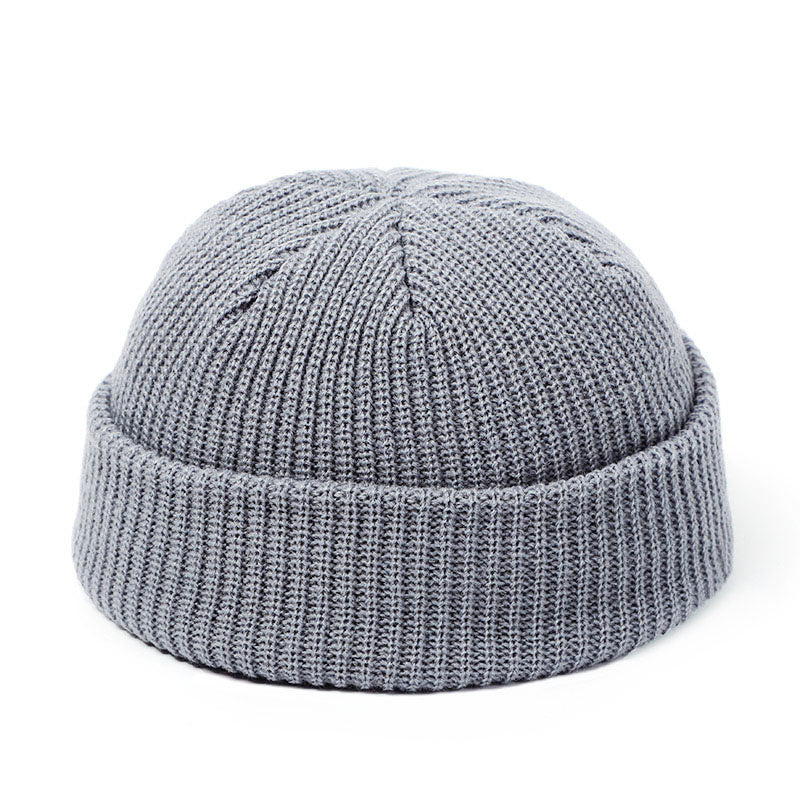 Stay stylish and warm this season with our fashionable Simple Warm Skullies Beanie Hat. Available in plain colors for a chic autumn and winter look. Makes the perfect gift choice.