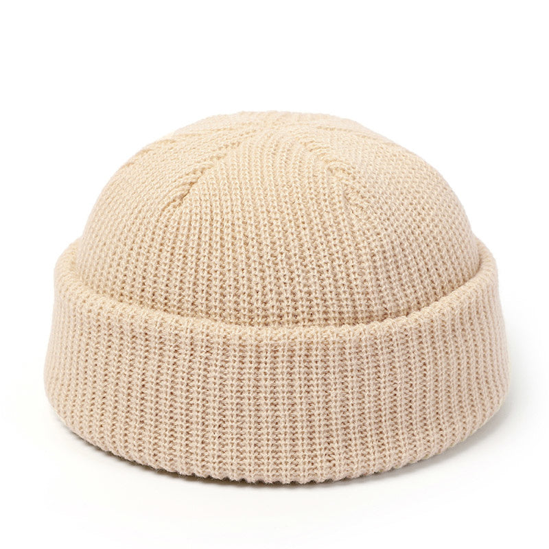 Stay stylish and warm this season with our fashionable Simple Warm Skullies Beanie Hat. Available in plain colors for a chic autumn and winter look. Makes the perfect gift choice.