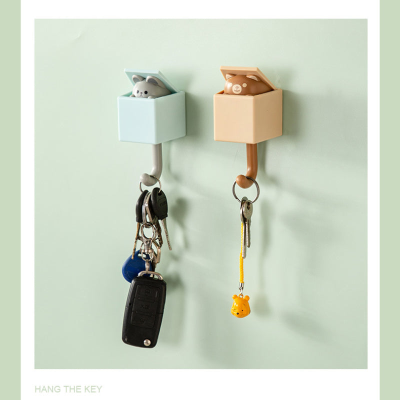 Punch-free retractable cat wall hook set for kitchen, bathroom, and office use. Strong and non-marking sticky hooks for hanging keys, coats, and more.