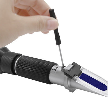 Handheld alcohol refractometer measures alcohol content and sugar concentration in wine, beer, and grapes up to 32% alcohol and Brix.