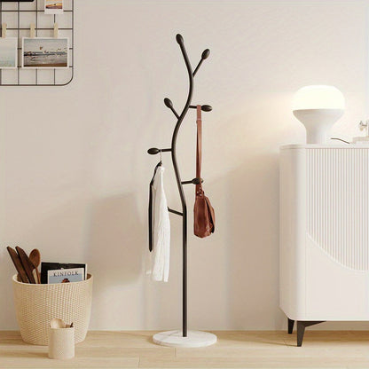 Simple and sleek, this freestanding coat rack is inspired by Scandinavian design. It's a versatile metal stand that can hold clothes in both the living room and bedroom.