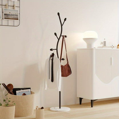 Simple and sleek, this freestanding coat rack is inspired by Scandinavian design. It's a versatile metal stand that can hold clothes in both the living room and bedroom.